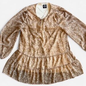 Gold/tan floral blouse with tie neck and ruffle hem. Size: Small like new!